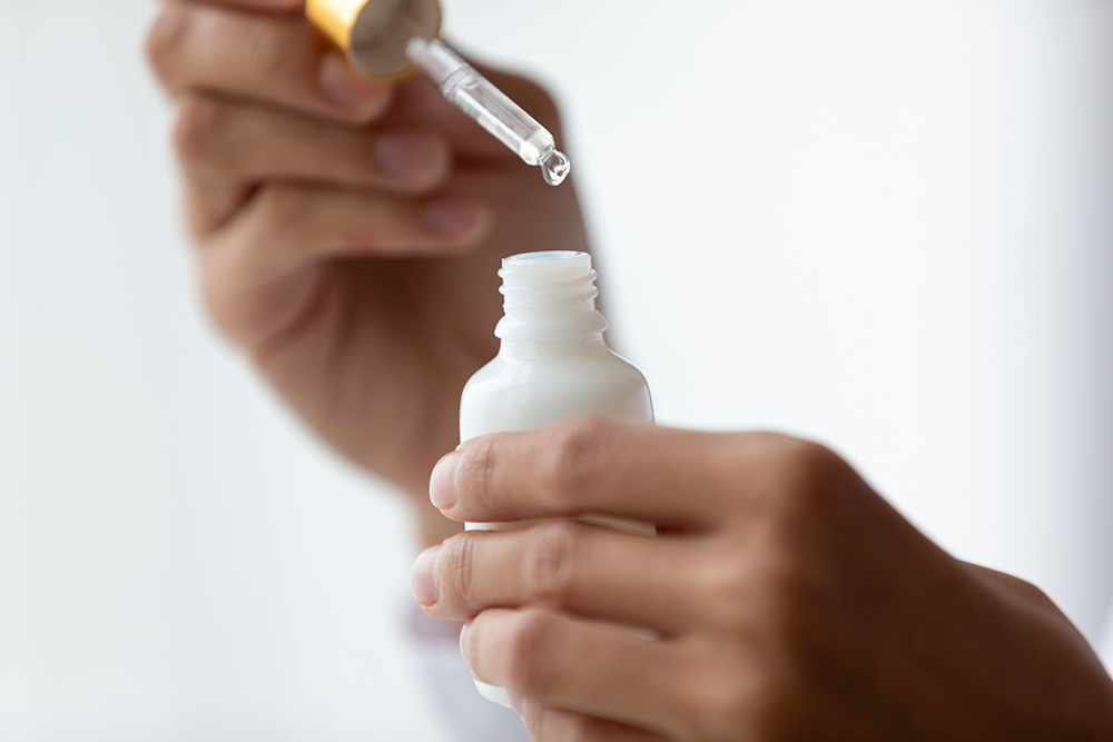 Retinol Serum with Hands and Dropper